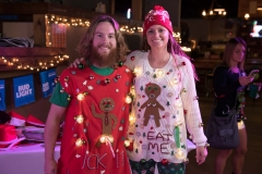 Guy and lady sweaters depicting naked gingerbread cookies