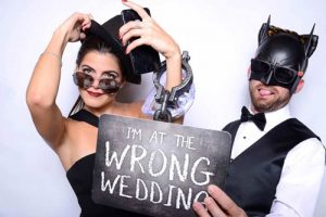 Belleair Photo Booth with a sign that reads "I am at the wrong wedding"
